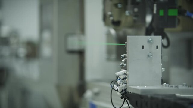 Automated cutting unit severs a tensioned temperature sensor cable