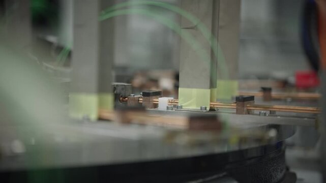 Automated manufacturing unit assembling temperature sensor cable components