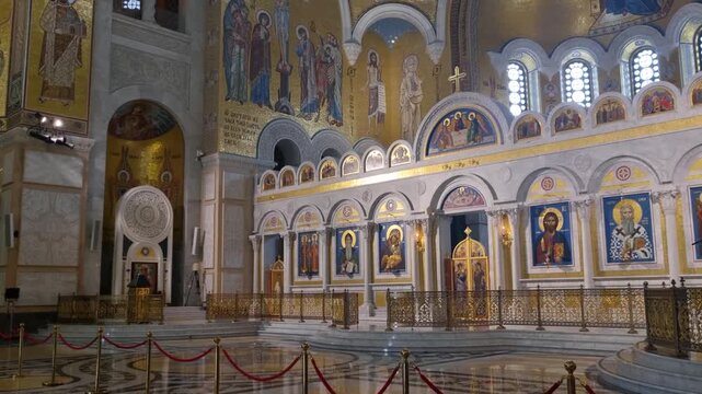 Interior view of the Dome of Saint Sava (Hram Svetog Save) in Belgrade, Serbia, showcasing rich ornamentation, frescoes, and sacred Orthodox art in a monumental church interior