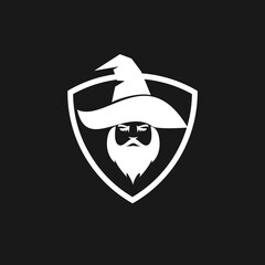 Fototapeta premium Minimalist Bearded Wizard Head in Pointed Hat Shield Logo Design