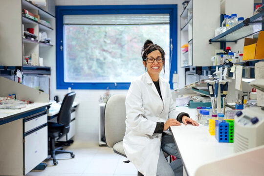 Scientist working in modern laboratory wearing white coat
