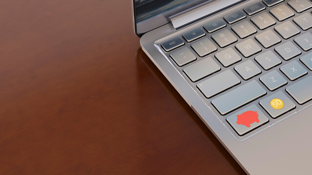 Piggy bank icon on laptop keyboard symbolizes online finance and saving