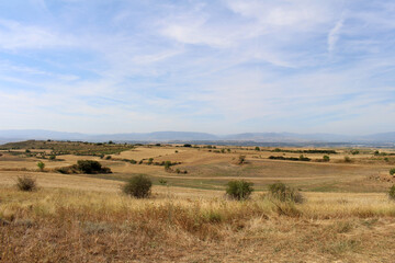Fototapeta premium Dirt path approaching Viana on Camino de Santiago Frances in Navarra Spain July 2024
