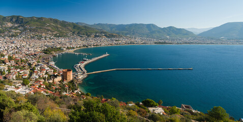 Fototapeta premium Antalya, Turkey - View of the Red Tower and Alanya harbour from the walls of Alanya castle.