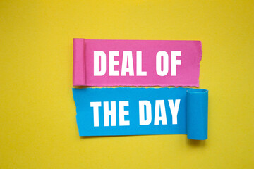 Deal of the Day message written on ripped torn paper background. Conceptual Deal of the Day symbol. Copy space.