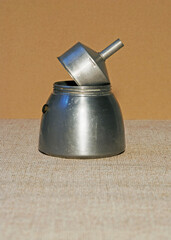 stacked parts of a moka coffee machine 