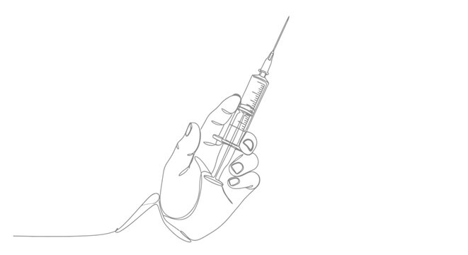 Hand holding a medical syringe with needle.