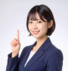 指をさすポーズの若いビジネスウーマン