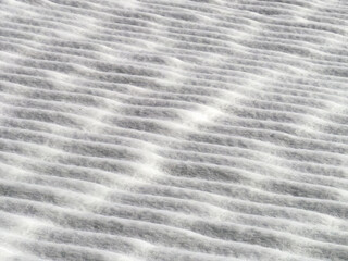 Obraz premium Snow-covered roof tiles create a beautiful pattern, suitable as a background image. Taken in Tremosine.