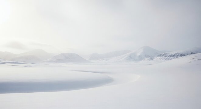 Frozen landscape with smooth snow formations and hazy mountain silhouettes. 
