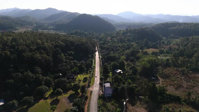 Road in dense forest in north Thailand, part of Mae Hong Son loop