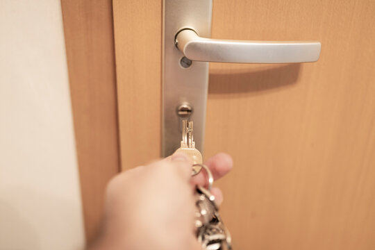 Germany, Hand of man locking home door