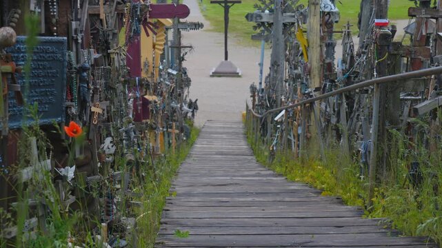 Sacred sculpture surrounded by offerings in Lithuania.