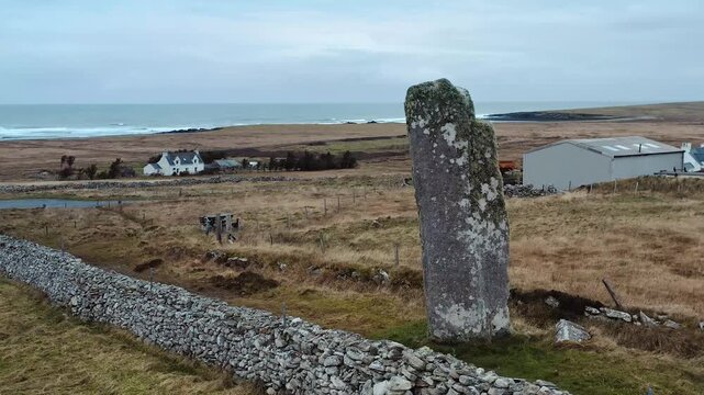 Low flying drone shot of Clach an Trushal standing stone on the Isle of Lewis.