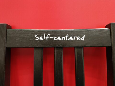 A chair with text written Self-centered - a person who makes everything about them or preoccupied with themselves