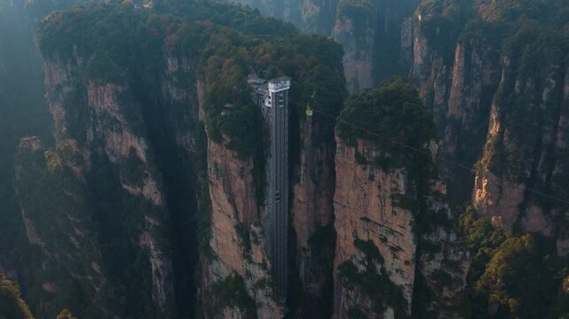 Bailong Elevator In The Wulingyuan Area Of The Zhangjiajie National Forest Park In Hunan, China. Aerial Drone Shot
