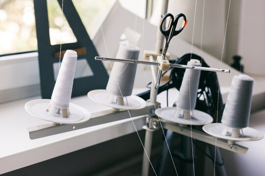 Spools and scissors in tailor shop