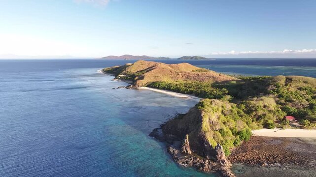 Beautiful aerial of remote Mana Island with golden sand beaches in Fiji, Pacific Islands