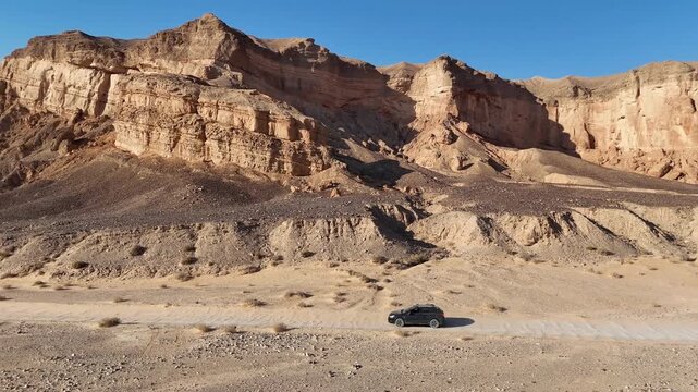 Aerial View Of Family Car Driving Desert Paran

Drone footage captured on February 12 2026 showing vehicle crossing vast Paran desert landscape Israel
