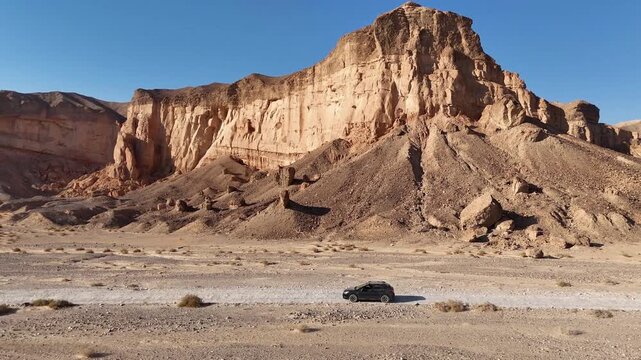 Aerial View Of Family Car Driving Desert Paran

Drone footage captured on February 12 2026 showing vehicle crossing vast Paran desert landscape Israel
