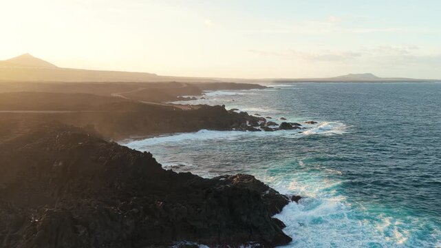Los Hervideros is a dramatic stretch of volcanic coastline in Yaiza, Lanzarote, where the Atlantic Ocean crashes into sea caves and basaltic cliffs. Formed during the Timanfaya eruptions between 1730 