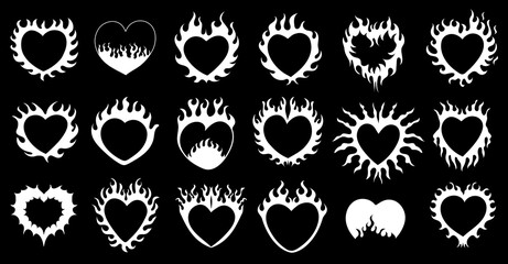 Collection of flaming heart silhouettes in gothic and tattoo style. Decorative burning love symbols isolated on black background. Perfect for Valentine themes, romantic designs, stickers, apparel prin