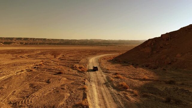 Aerial View Of Family Car Driving Desert Paran

Drone footage captured on February 12 2026 showing vehicle crossing vast Paran desert landscape Israel
