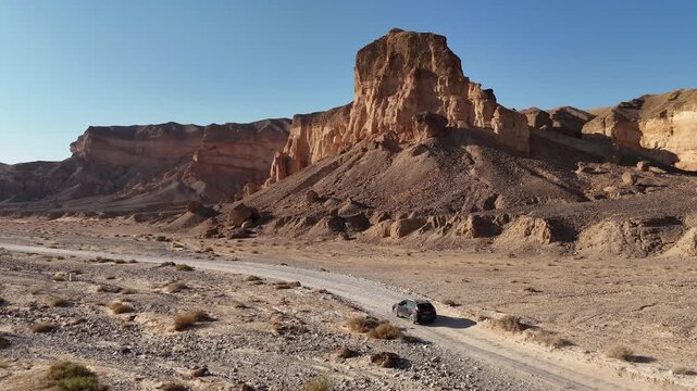 Aerial View Jeep Driving In Paran Desert Israel

Drone footage captured on February 12 2026 showing jeep traveling along desert road near cliffs Israel
