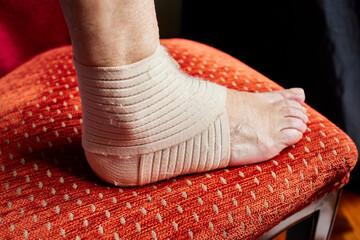 Ankle brace. Woman's foot wearing an ankle brace to recover from an instep injury.