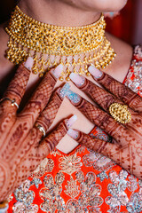 Intricate Bridal Mehndi and Gold Jewelry