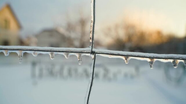 Wire covered in ice after freezing rain, close-up