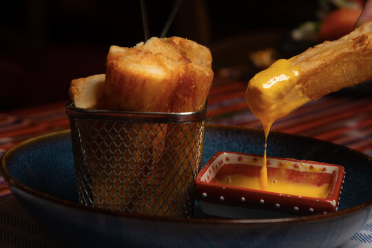 Yuca frita, dipping sauce rocoto. peruvian food