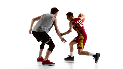 Basketball player turning back while protecting ball from defender isolated on white. Concept of sportswear ads, athletic brand campaign, basketball gear promotion and ecommerce product visuals.