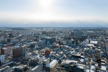 Naklejka premium Winter Cityscape of Obihiro, Hokkaido, Japan under Cloudy Sky
