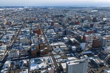 Fototapeta premium Winter Cityscape of Obihiro, Hokkaido, Japan under Cloudy Sky
