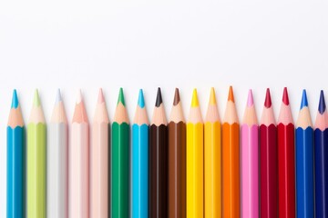 Colorful sharpened pencils aligning horizontally, showing a spectrum of artistic colors