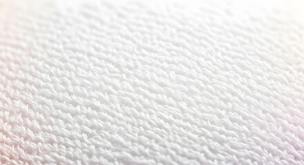 Close-up macro photo of a soft, fluffy white terry cloth towel texture with subtle light pink and blue color gradients.