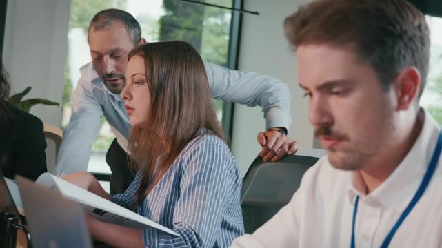 Diverse business team collaborating in a modern corporate office