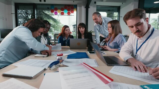 Business team collaborating on project in office meeting room