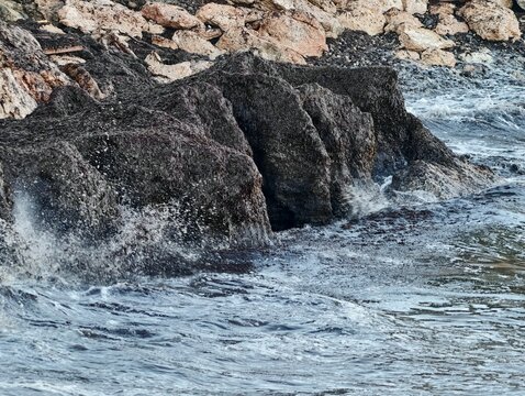 Dynamic ocean waves gradually sculpt resilient rocky coastlines amid ongoing environmental shifts