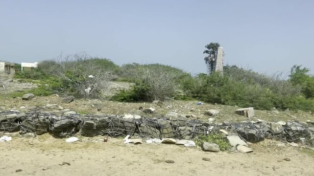 View of a island from a moving car - Clear view of Sands, Stones nearby to the sea