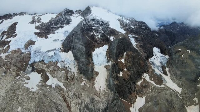 Mountain Ice Vista. High Altitude Icy Panorama Featuring Rugged Peaks And Glacial Features Visible