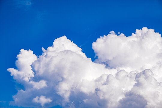 thick white clouds in a blue sky during the day