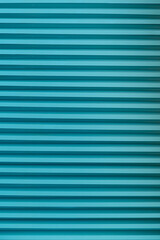 Fototapeta premium Background of red vertical metal strips.