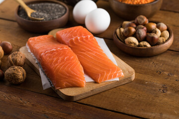 Selection food sources of omega 3 and unsaturated fats. Super food salmon, eeg, nuts, chia seeds, avocado.