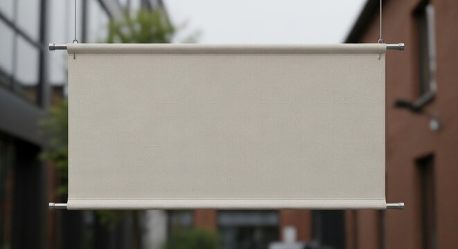 A blank, rectangular sign hanging outside a building.
