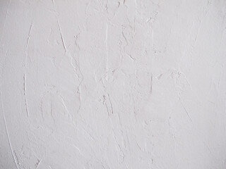 Fototapeta premium White textured wall with spatula strokes, white paint, plaster.