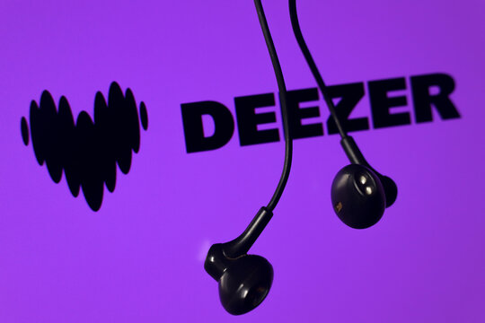The Deezer logo is seen on the screen and a headset in this photo illustration in Ontario, Canada, on February 13, 2026