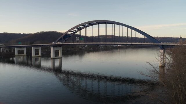 Wheeling Highway Bridge over the River and Reflection at sunset in the Fall