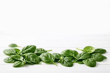 Fresh Spinach Leaves on White Minimalist Table